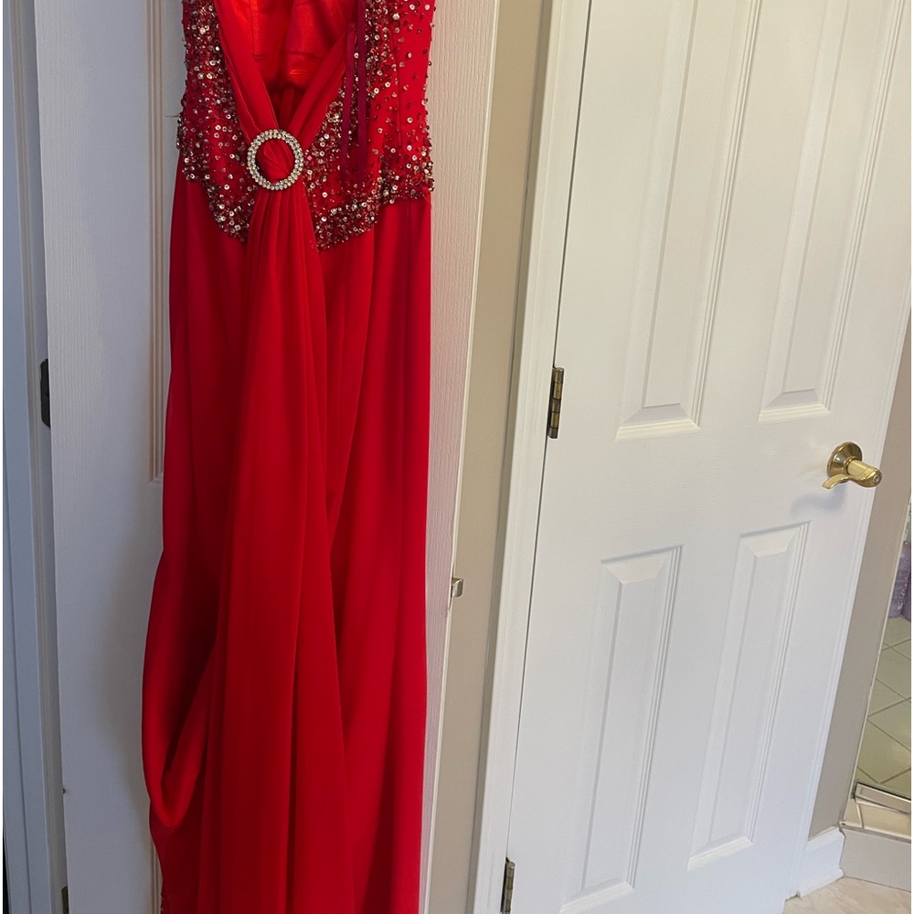 Formal and striking backless gown. Great for the holidays. Worn once. Size 0.